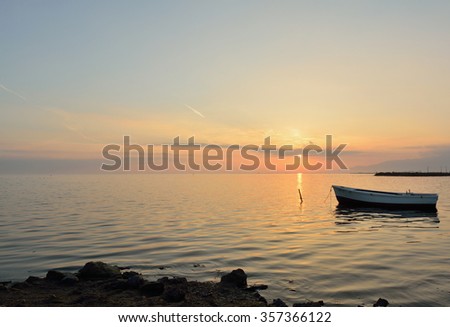 Boat at sunset within Delta del Ebro natural Park, Tarragona, Spain