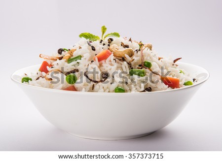 Veg biryani or veg pulav served in a round brass bowl, selective focus
 Royalty-Free Stock Photo #357373715