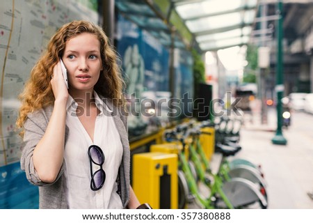 Young business woman portrait talking in the street of Bangkok, Thailand. 