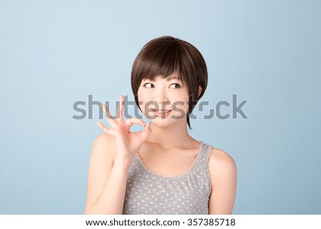 Woman making a sign with your fingers