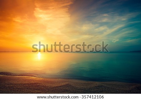 Early morning, sunrise over sea Royalty-Free Stock Photo #357412106