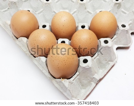 Brown chicken eggs isolated on white