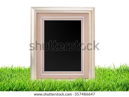 Photo frame on green grass nature background