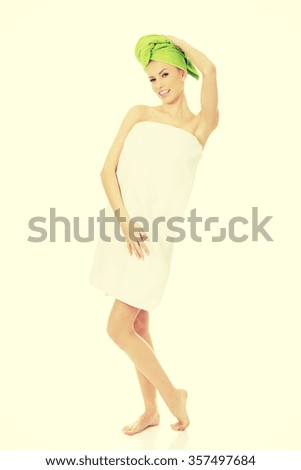Beautiful woman with towel wrapped on head.