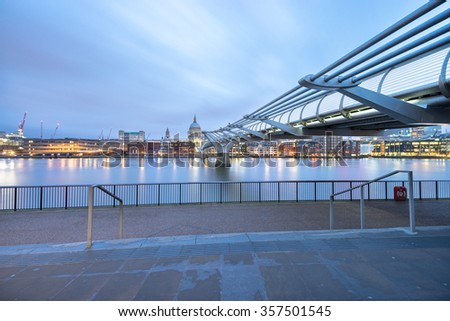 Millennium bridge and St.Paul's cathedral viewed at sunrise in London, England