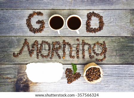 good morning concept - coffee beans, Cup of black coffee, heart from coffee beans, coffee leaves. paper sticker for tex.  Toned, selective focus image. lovely message