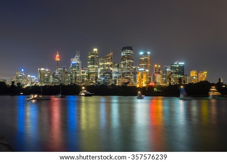 Beautiful scene of colorful Sydney city skyline at night with reflection