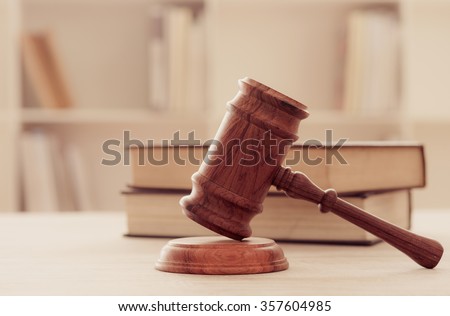 Judges gavel on wooden table with law books. retro style. concept of legal ruling. Royalty-Free Stock Photo #357604985