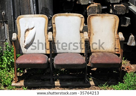 three old cinema seats