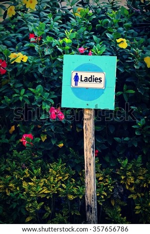 Female toilet signs.