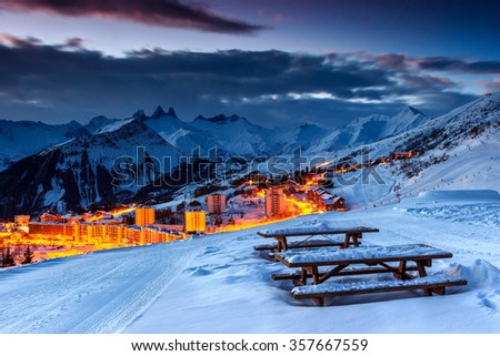 Majestic winter sunrise landscape and ski resort with resting place in French Alps,La Toussuire,France,Europe Royalty-Free Stock Photo #357667559