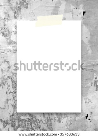 Close-up of one paper sheet with tape on scratched wall background