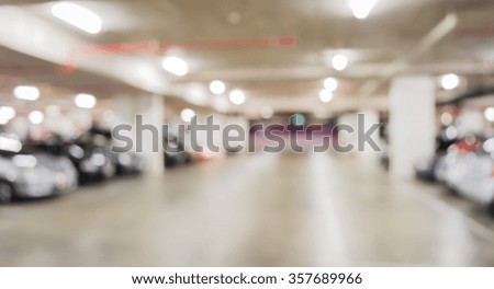 blur image with bokeh of Car park interior for background usage.