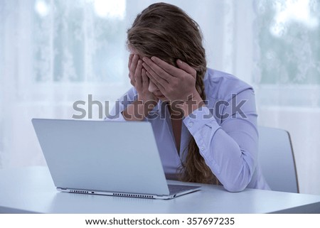 Image of despair female cyberbullying victim covering eyes Royalty-Free Stock Photo #357697235