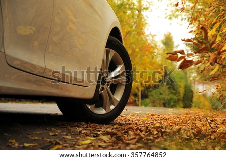 White car and autumn Royalty-Free Stock Photo #357764852