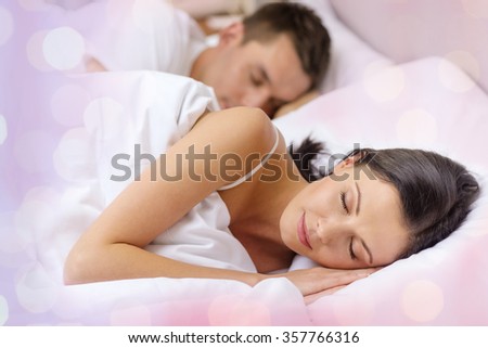 happy couple sleeping in bed