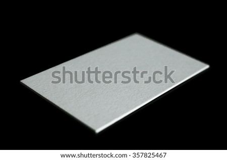 Blank white business cards on black background. Photo mock-up.