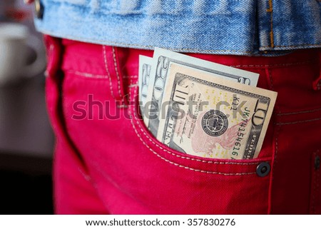 Euro banknotes in jeans pocket closeup