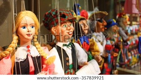 Traditional puppets made of wood. Shop in Prague - Czech Republic Royalty-Free Stock Photo #357839921