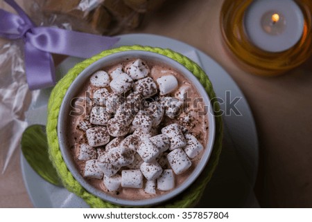 Cup of hot cocoa with marshmallows, close up, top view.