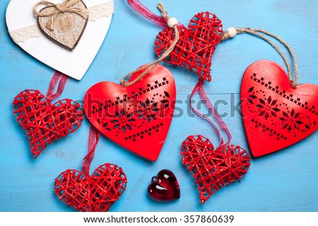 Red hearts on wooden background. Symbol of love in valentine's day.