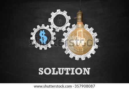 Light bulbs with gear up SOLUTION text on Blackboard ,  business concept , business idea