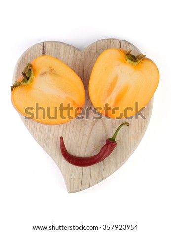 Smile fruit face on a cutting board.