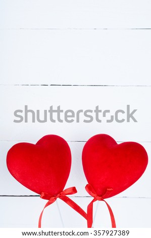 Valentines Day background concept with copy space. Two hearts on a white wooden background