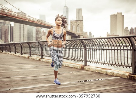 Girl running on the pier with New york skyline in the background
