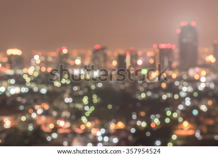 Blur city background rooftop view of Bangkok cityscape business building landscape night lights bokeh  