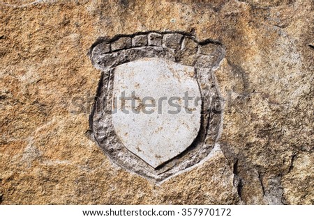 Blank emblem shield hewn in stone