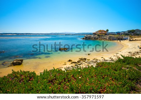 Beach & Building on Cannery Row in Monterey, California, USA Royalty-Free Stock Photo #357971597