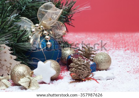 Various ornaments for the Christmas and New Year, shiny toys, cones, stars near the fir branches