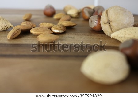 nuts in a shell on a wood board grouped