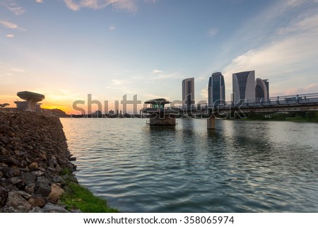 Beautiful sunset at recreation park in Putrajaya with its iconic building in the background, Malaysia. 