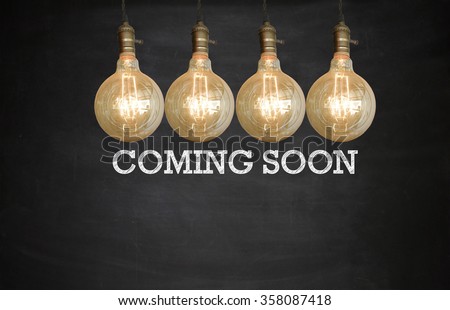 Light bulbs with COMING SOON on Blackboard , business concept , business idea