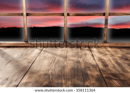 window old sill and sky of red color 