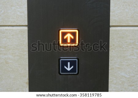 Up and down elevator buttons with up-button lighten up