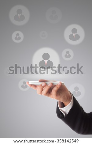 businessman using smart phone to communicate his team.
 Virtual meeting technology for global business concept.