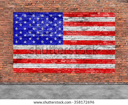 American flag painted over old brick wall