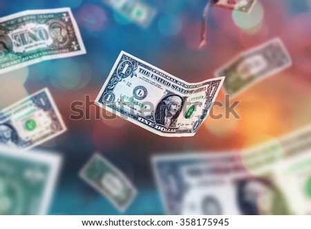 Dollar bills falling to the ground
