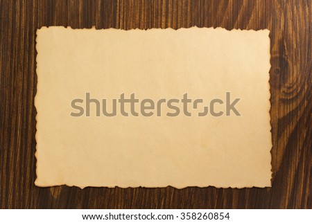 paper parchment on wooden background