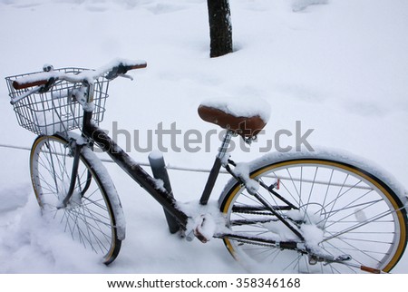 Frozen bike on the winter street