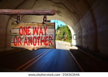 One way or another motivational phrase sign on old wood with blurred background