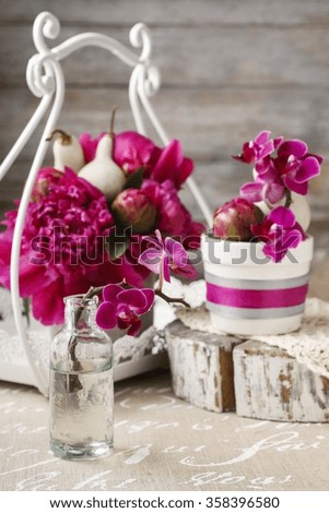 Orchids and peonies - summer table decoration