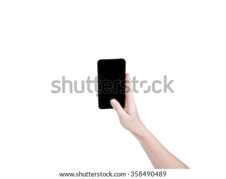 Female hand holding a black telephone isolated on a white background.
