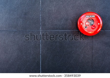 fire alarm on black wall