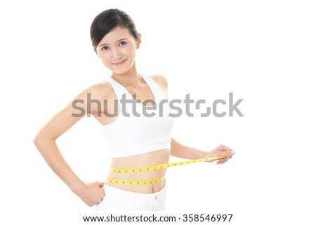 Woman who is measuring her waist