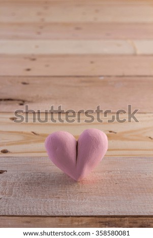Valentine's Day with heart icon object on wooden floor