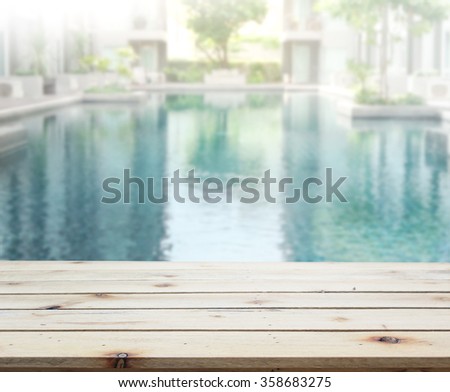 Wood Table Top of The Background and Pool